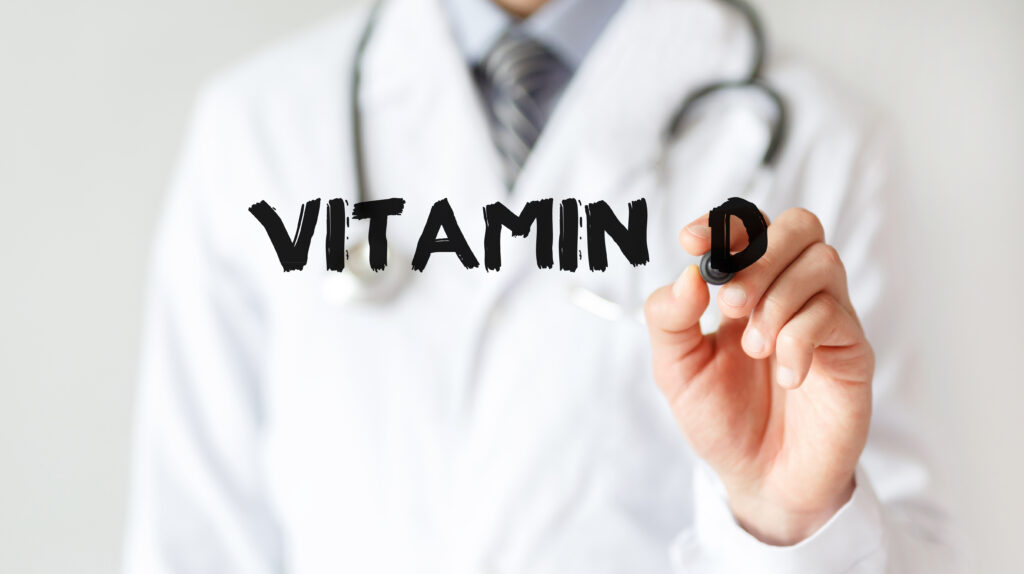 Doctor writing "Vitamin D"