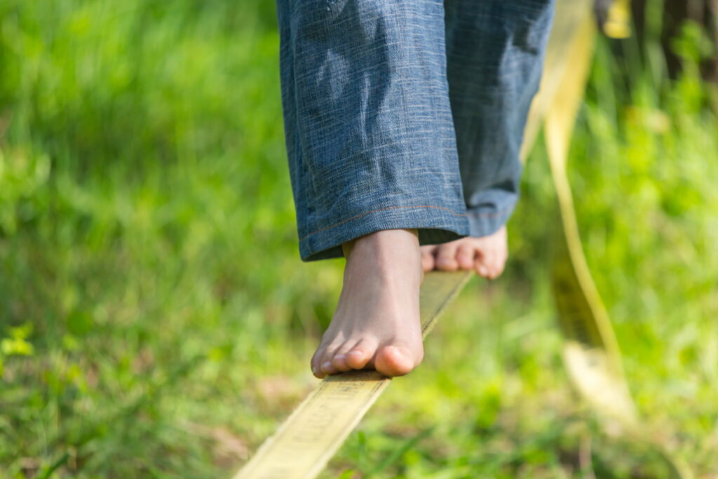 Woman walking a tightrope